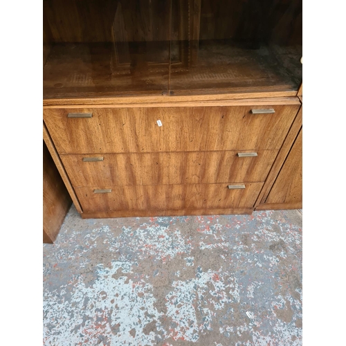 390 - Three mid 20th century American oak cabinets to include two display cabinets with smoked glass doors... 