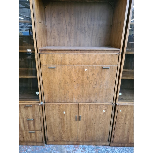 390 - Three mid 20th century American oak cabinets to include two display cabinets with smoked glass doors... 