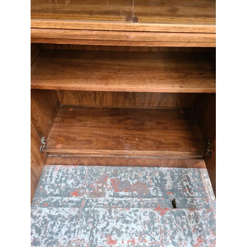 390 - Three mid 20th century American oak cabinets to include two display cabinets with smoked glass doors... 