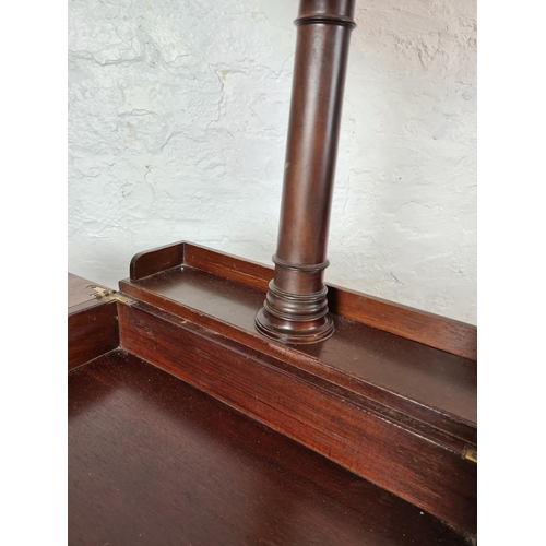 398 - An Edwardian mahogany shaving stand with hexagonal bevelled edge mirror