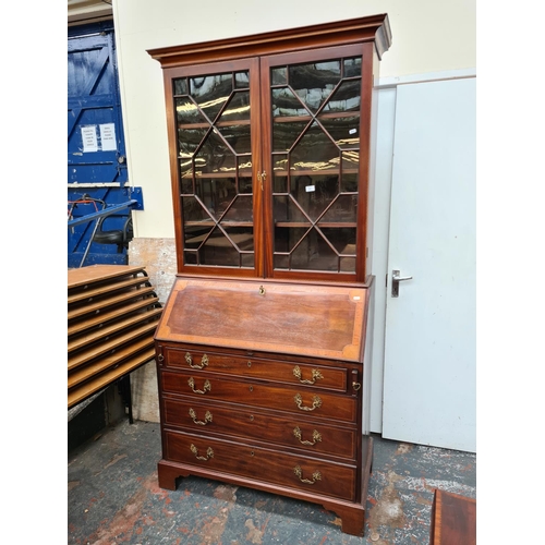 402 - A fine 19th century inlaid mahogany bureau bookcase, the figured fall front with broad satinwood ban... 