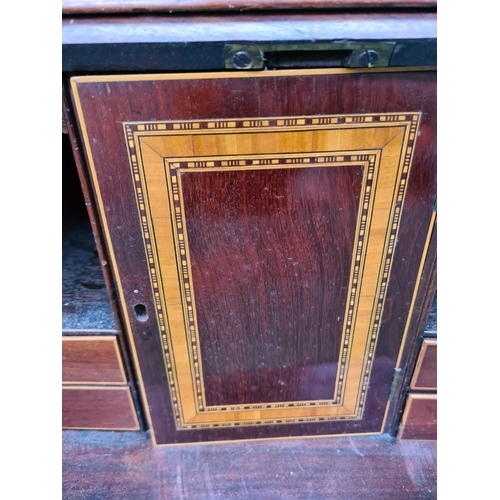 402 - A fine 19th century inlaid mahogany bureau bookcase, the figured fall front with broad satinwood ban... 