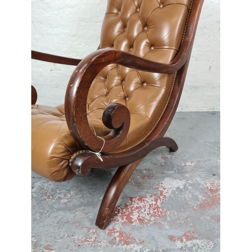 413 - A vintage mahogany and tan leather Chesterfield slipper chair