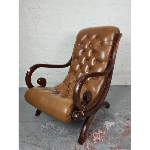 413 - A vintage mahogany and tan leather Chesterfield slipper chair