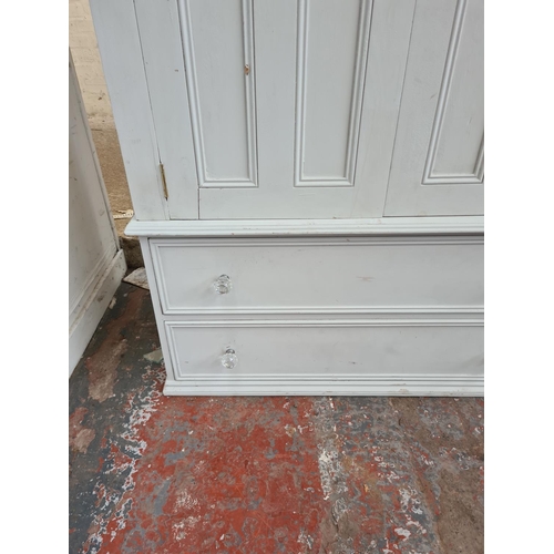 422 - A grey painted pine double wardrobe - approx. 196cm high x 110cm wide x 55cm deep