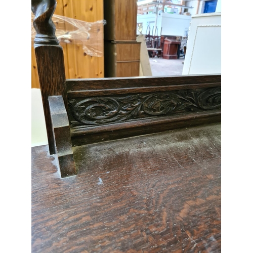 429 - An early 20th century oak dressing chest on casters with mirror on barley twist supports - approx. 1... 