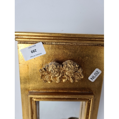 289 - Two antique style wall mirrors