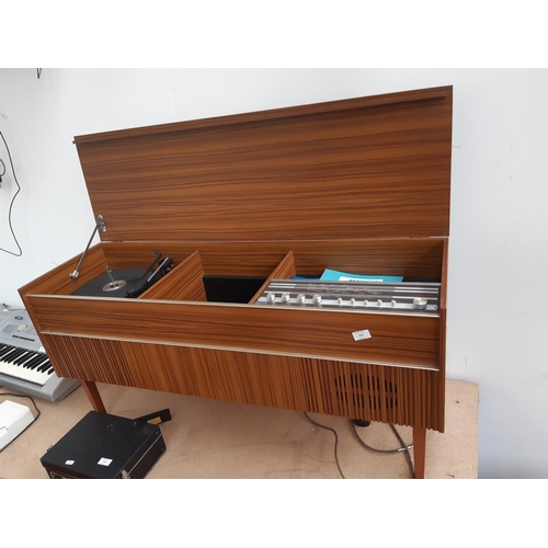 1001 - A 1970s teak effect model 3369 Ferguson stereo radiogram with tuner amp, turntable and instruction m... 