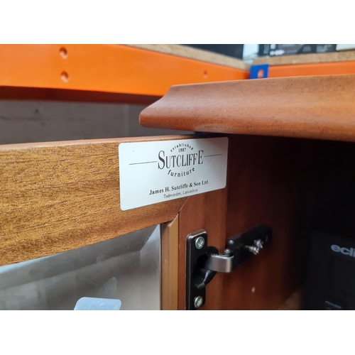 1003 - A Sutcliffe hi-fi cabinet containing an Aiwa hi-fi comprising twin tape deck, tuner amp with graphic... 