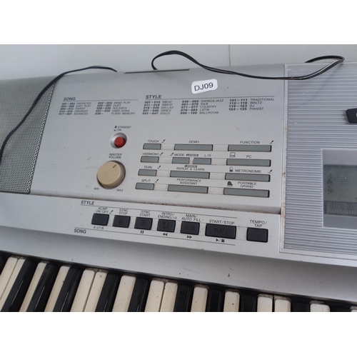 1006 - A Yamaha DGX-205 'Portable Grand' Electric Piano/Electronic Keyboard with power pack