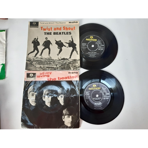 1033 - A record case containing a collection of approx. 22 Beatles 7