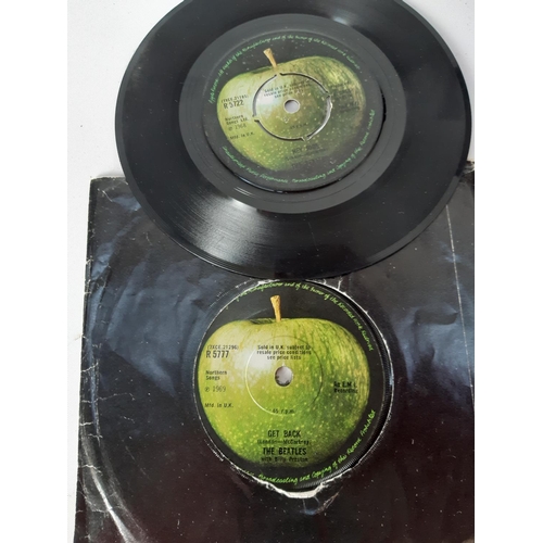 1033 - A record case containing a collection of approx. 22 Beatles 7