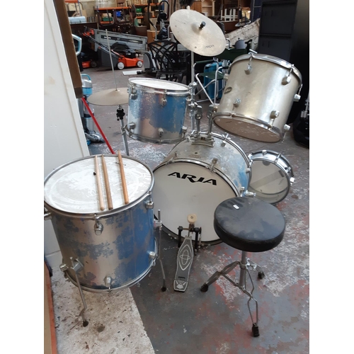 1045 - An eight piece Aria drum kit to include two rack toms, one floor tom, snare, hi-hat, crash cymbal, s... 