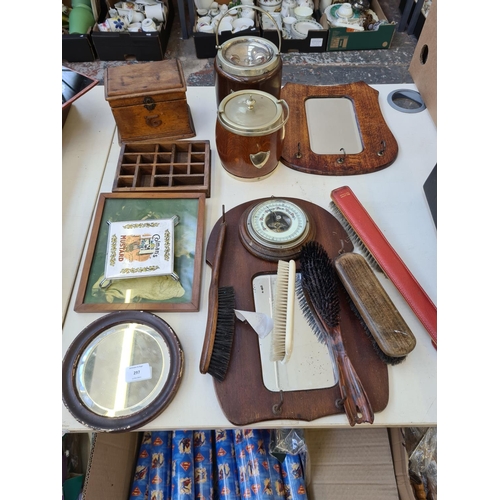 297 - A collection of various items to include a H & R Johnson Ltd. colman's mustard coaster, two oak bisc... 