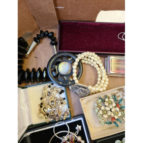 300 - A box containing various costume jewellery
