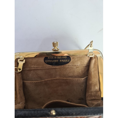 302 - Four various ladies bags to include two Estee Lauder, one snakeskin and one black