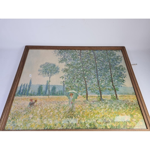 320 - A large framed print of Claude Monet's 'Fields In Spring' original painted in 1887 approx. 95cm x 77... 