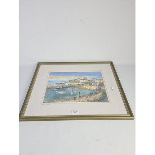 321 - A framed watercolour of Tenby South Wales by Valerie J Tomey - approx. 54cm x 44cm