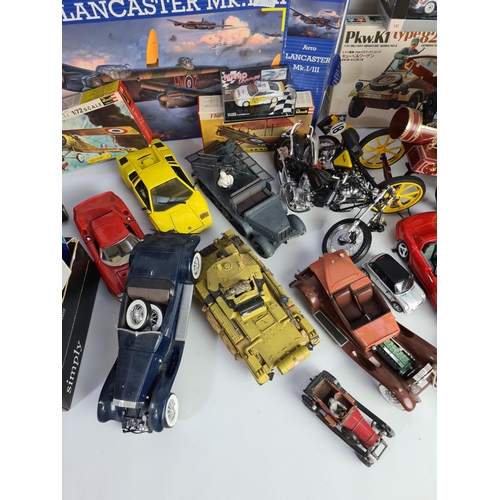 227 - A large quantity of various model making kits and model vehicles