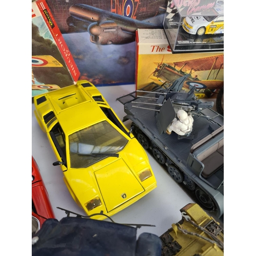 227 - A large quantity of various model making kits and model vehicles