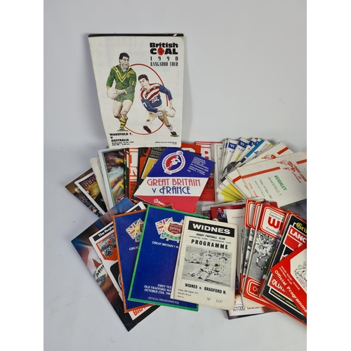 234 - A large collection of vintage rugby match day programmes