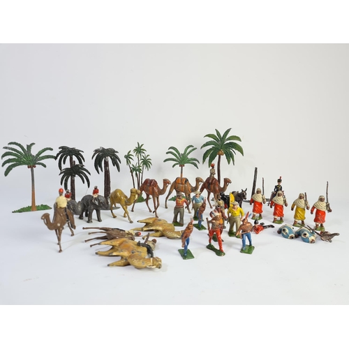 239 - A collection of vintage lead figurines and accessories to include some Britains