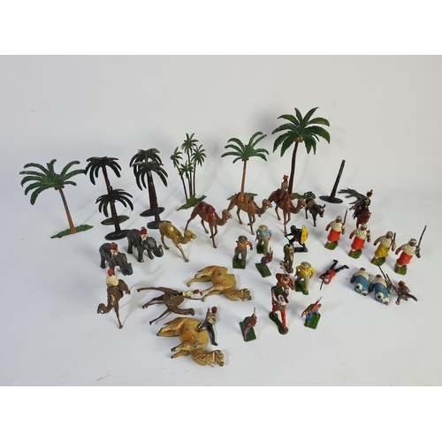 239 - A collection of vintage lead figurines and accessories to include some Britains