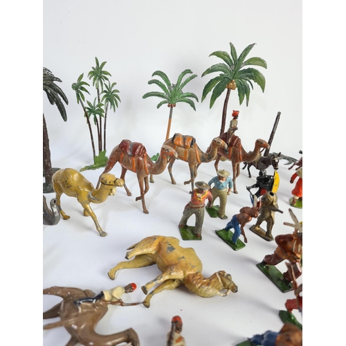 239 - A collection of vintage lead figurines and accessories to include some Britains