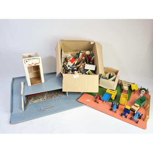 242 - A collection of various toys to include wooden farm yard, Dinky Massey Harris tractor, animals, Matc... 