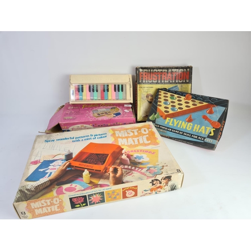 243 - Four vintage boxed games to include Frustration, Flying Hats, Portable Organ and Mist-o-matic