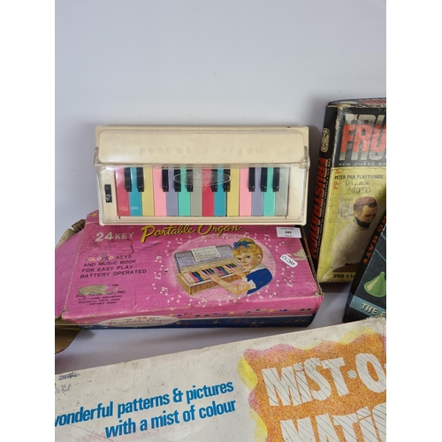 243 - Four vintage boxed games to include Frustration, Flying Hats, Portable Organ and Mist-o-matic