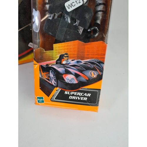 244 - A boxed Action Man super car with super car driver and stickers