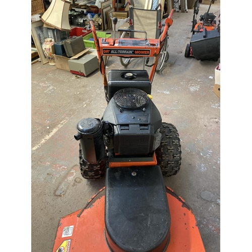 1269 - A black and orange DR all terrain petrol lawnmower with Kawasaki electric start engine