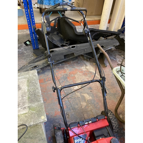 A black and red Rover Pro Cut 950 petrol lawnmower with 880 OHV engine without grass box