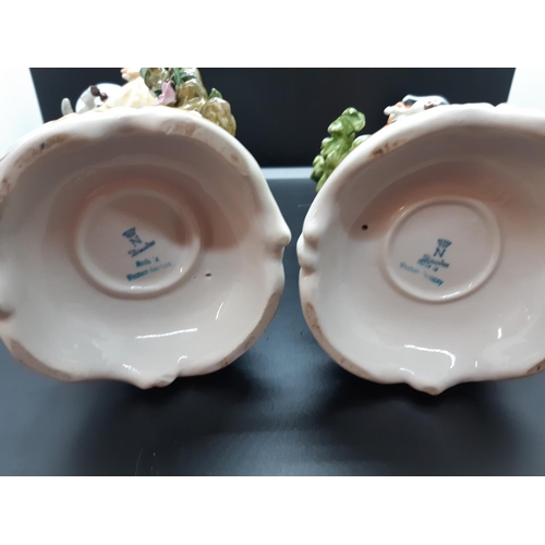 109 - A pair of West German hand painted porcelain figurines - approx. 26cm high