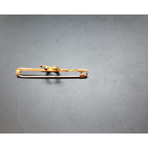 21 - A stamped 9ct gold horseshoe pin brooch - approx. 1.94 grams