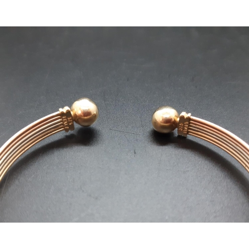 39 - A hallmarked 9ct gold tri-colour ladies bangle - approx. weight 6.1 grams