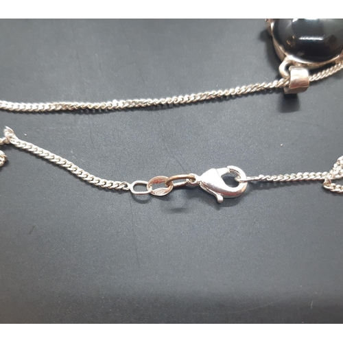 57 - A hallmarked 925 silver pendant necklace with black stone