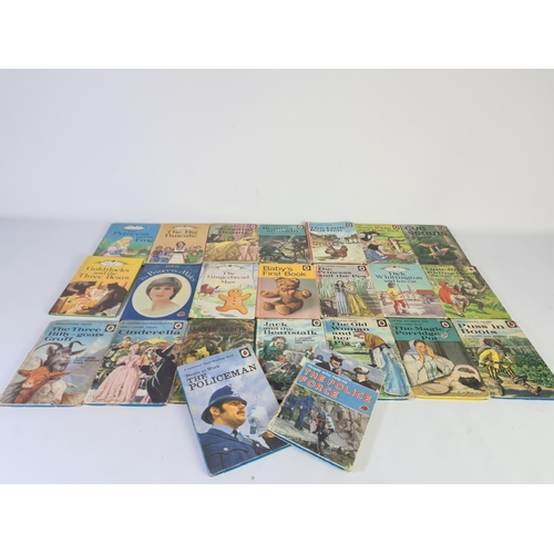 232A - A collection of vintage Ladybird books to include The Policeman, The Princess and The Pea, Puss in B... 