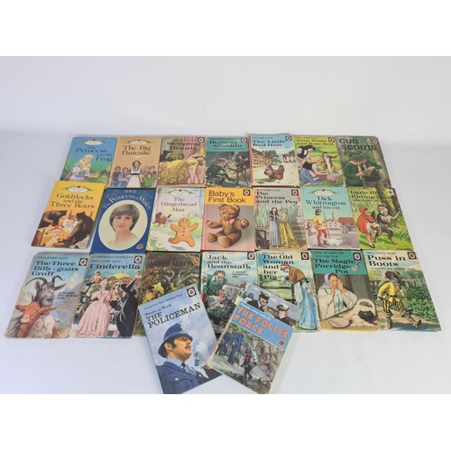 232A - A collection of vintage Ladybird books to include The Policeman, The Princess and The Pea, Puss in B... 