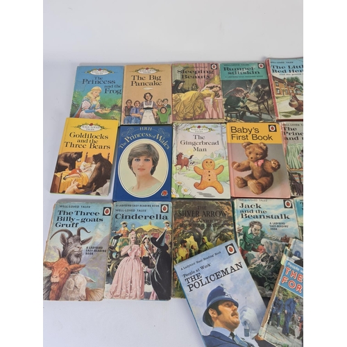 232A - A collection of vintage Ladybird books to include The Policeman, The Princess and The Pea, Puss in B... 