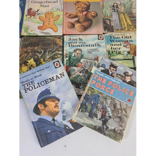 232A - A collection of vintage Ladybird books to include The Policeman, The Princess and The Pea, Puss in B... 