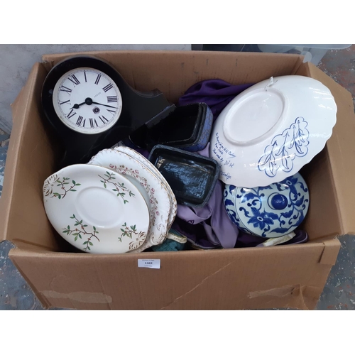 1369 - A box containing various items to include Laura Ashley mantel clock, Chinese blue and white ceramic ... 