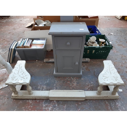 1381 - Two items, one grey painted pine bedside cabinet and one carved grey painted wooden fire fender