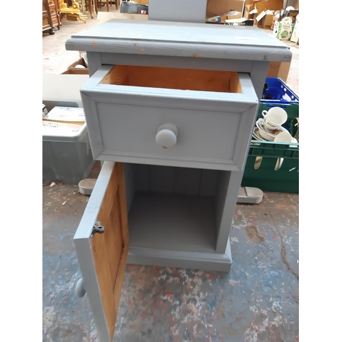 1381 - Two items, one grey painted pine bedside cabinet and one carved grey painted wooden fire fender