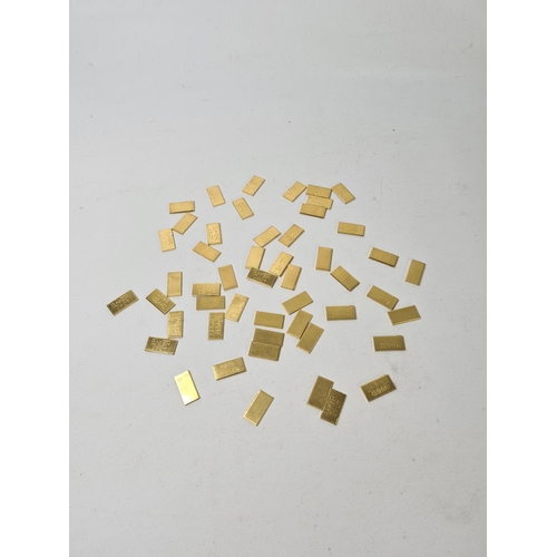 59 - Fifty 22ct gold tooth caps/grills - approx. weight 100 grams