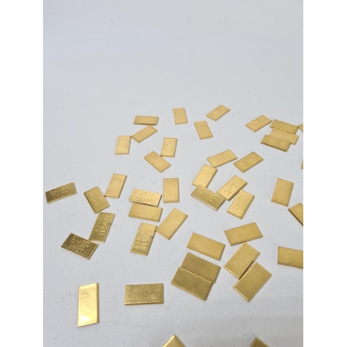 59 - Fifty 22ct gold tooth caps/grills - approx. weight 100 grams