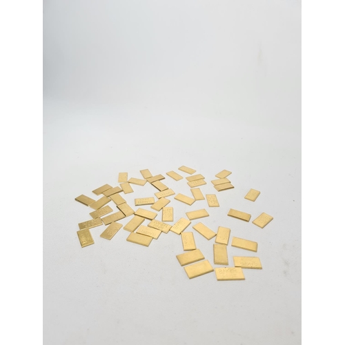 60 - Fifty 22ct gold tooth caps/grills - approx. weight 100 grams