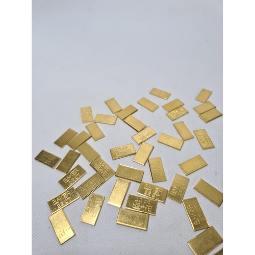 60 - Fifty 22ct gold tooth caps/grills - approx. weight 100 grams