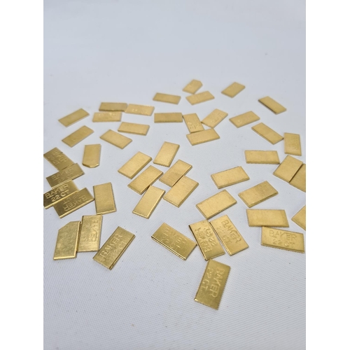 61 - Fifty 22ct gold tooth caps/grills - approx. weight 99.64 grams